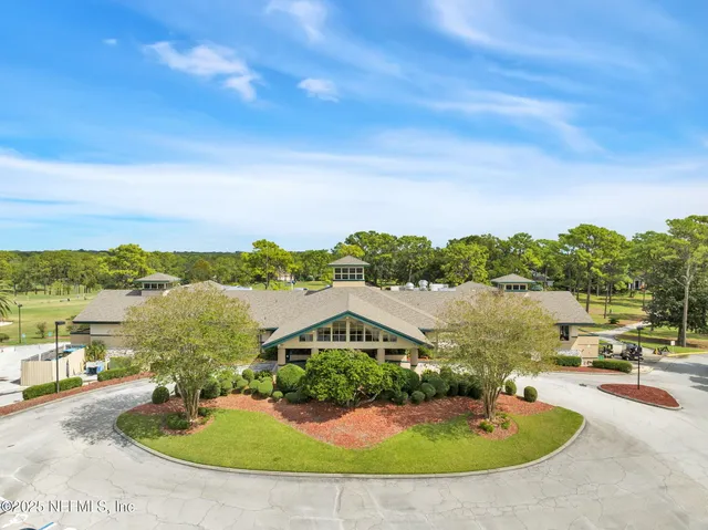 a view of a swimming pool with an outdoor seating