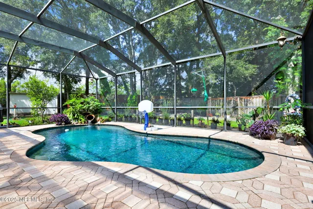 a view of a backyard with sitting area