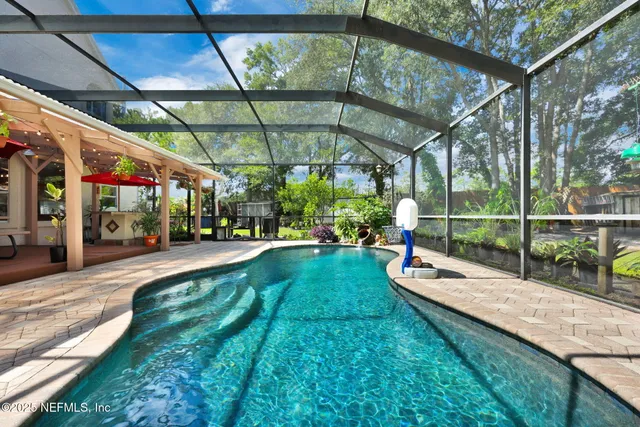 a view of swimming pool with a patio