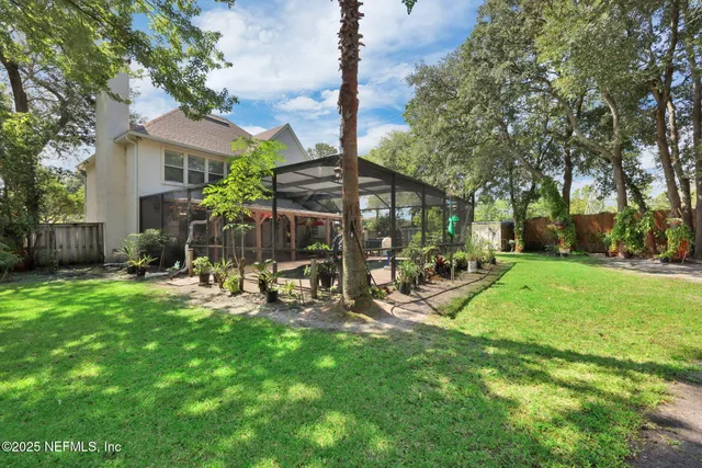 a view of a backyard with sitting area