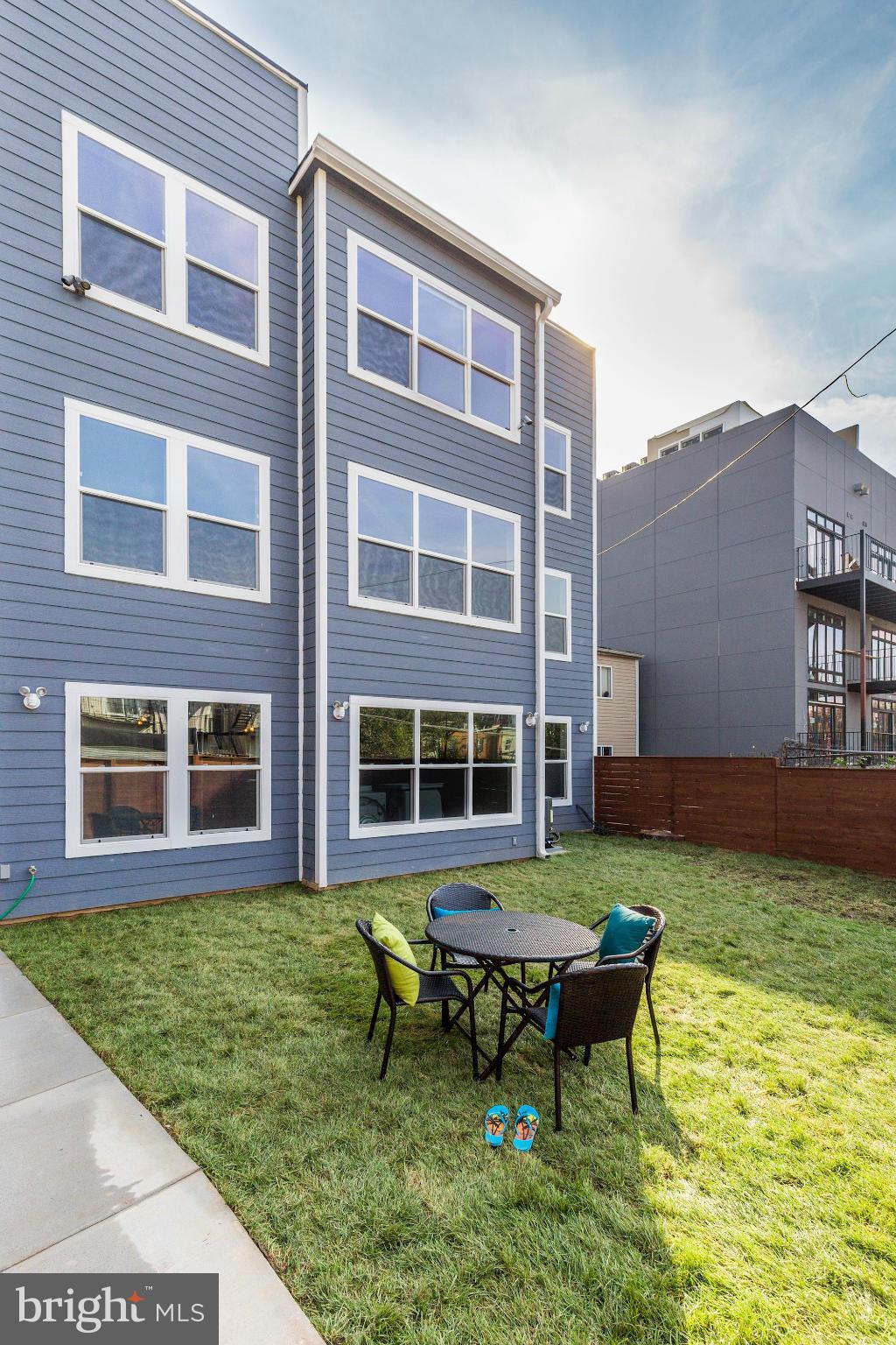 1920 3rd Street Northeast, Unit 7 Washington, DC 20002 - Photo 12 of 21 a backyard of a house with yard fire pit and outdoor seating
