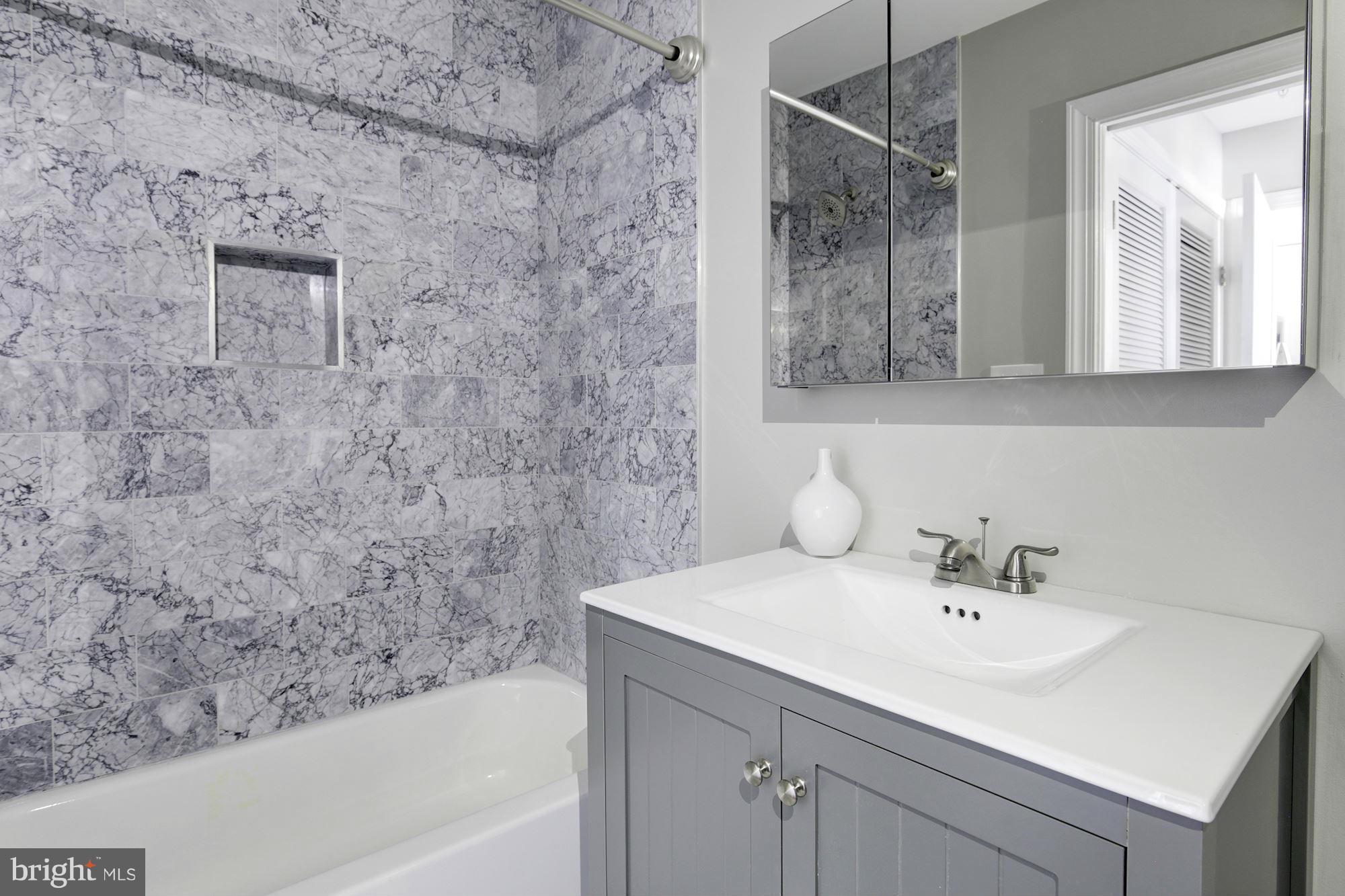 1920 3rd Street Northeast, Unit 7 Washington, DC 20002 - Photo 9 of 21 a bathroom with a sink and a bathtub
