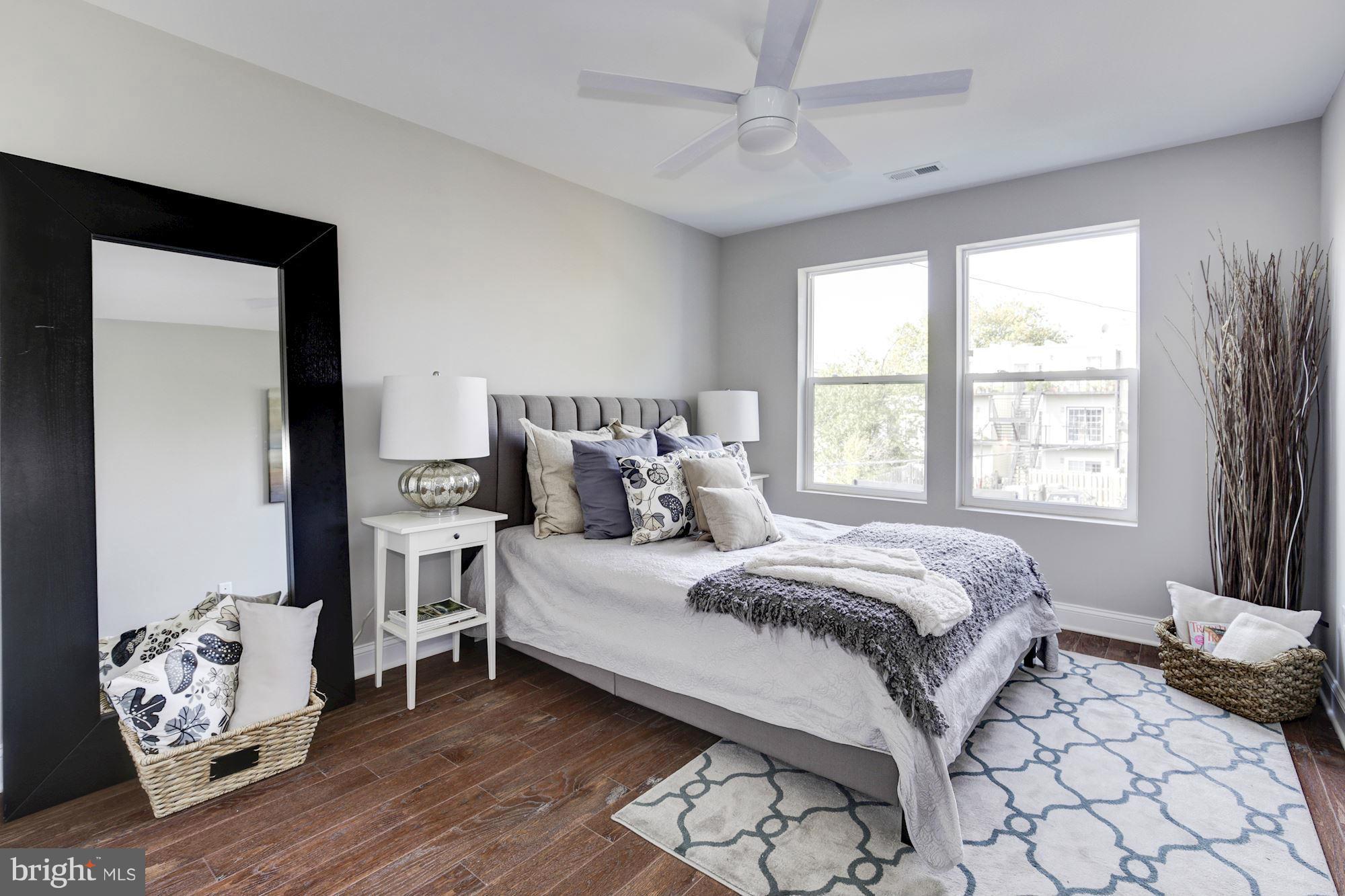 1920 3rd Street Northeast, Unit 7 Washington, DC 20002 - Photo 10 of 21 a bedroom with a bed and a window