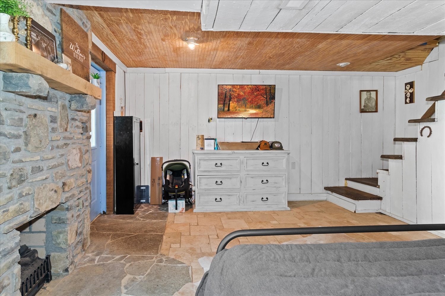 2095 Coyle Road Lynnville, TN 38472 - Photo 15 of 28 primary suite features a stone fireplace with electric insert (gas line installed if you want to place a tank)
