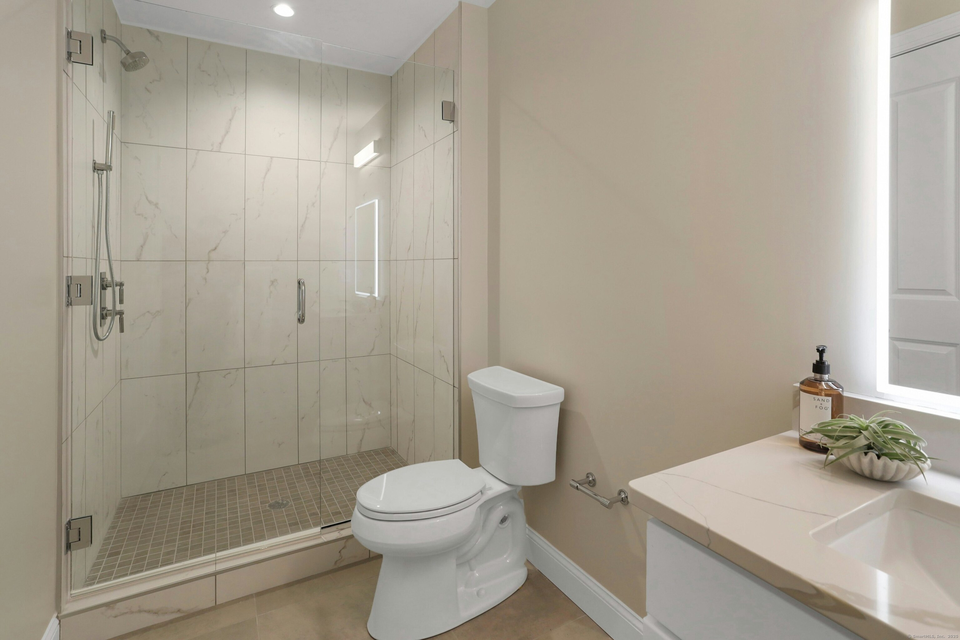 440 Heights Road, Unit 205 Darien, CT 06820 - Photo 12 of 15 a bathroom with a sink a toilet and shower