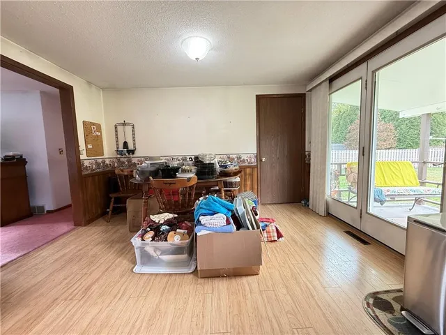 a spacious bathroom with a double vanity sink a large mirror and a bathtub