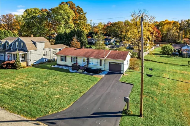 a view of a house with a yard