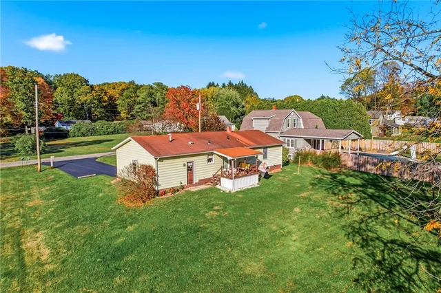 a aerial view of a house with garden space and street view