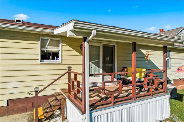a view of a house with sitting area and furniture