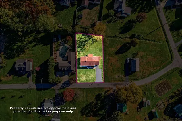 a view of backyard with plants and outdoor seating