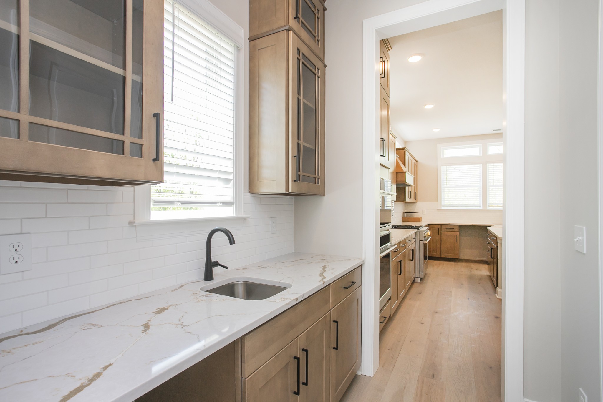 5956 Hunt Vly Drive Spring Hill, TN 37174 - Photo 14 of 53 a kitchen with a sink and cabinets