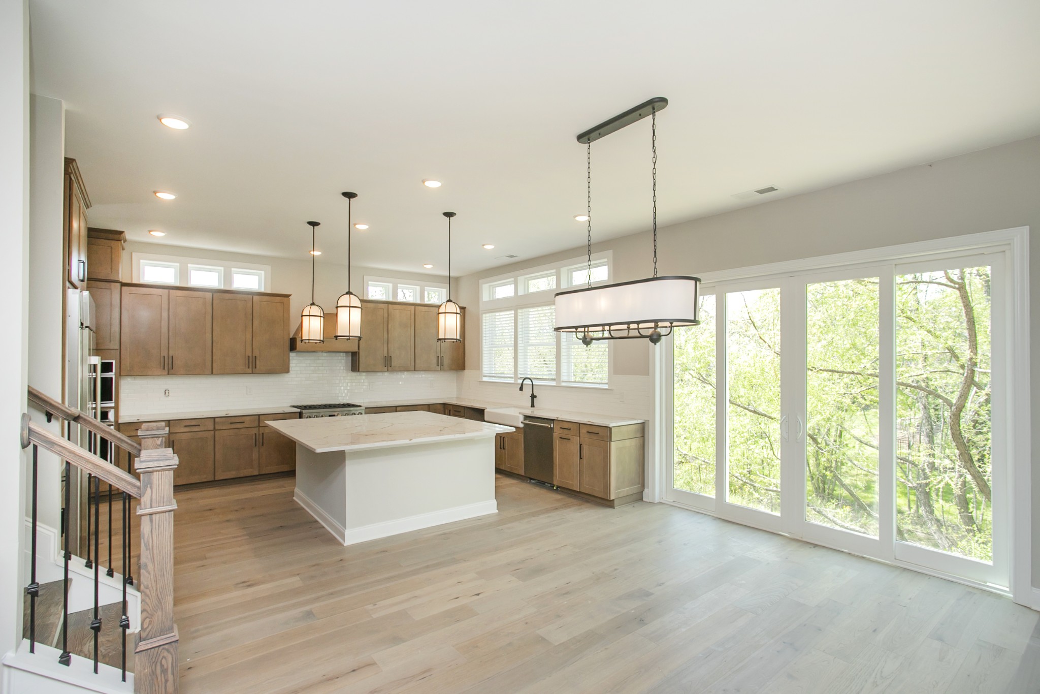 5956 Hunt Vly Drive Spring Hill, TN 37174 - Photo 15 of 53 a large kitchen with kitchen island a large island in it