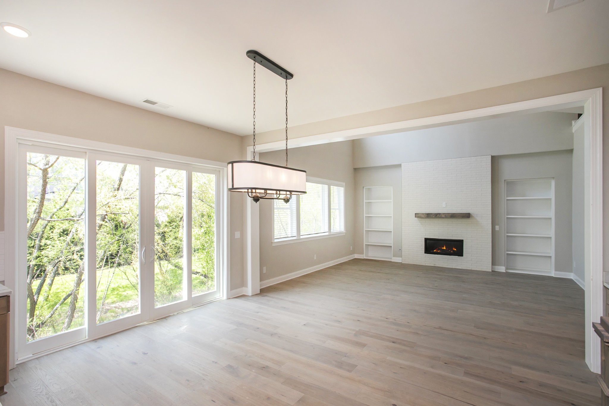 5956 Hunt Vly Drive Spring Hill, TN 37174 - Photo 20 of 53 a view of empty room with wooden floor and fireplace