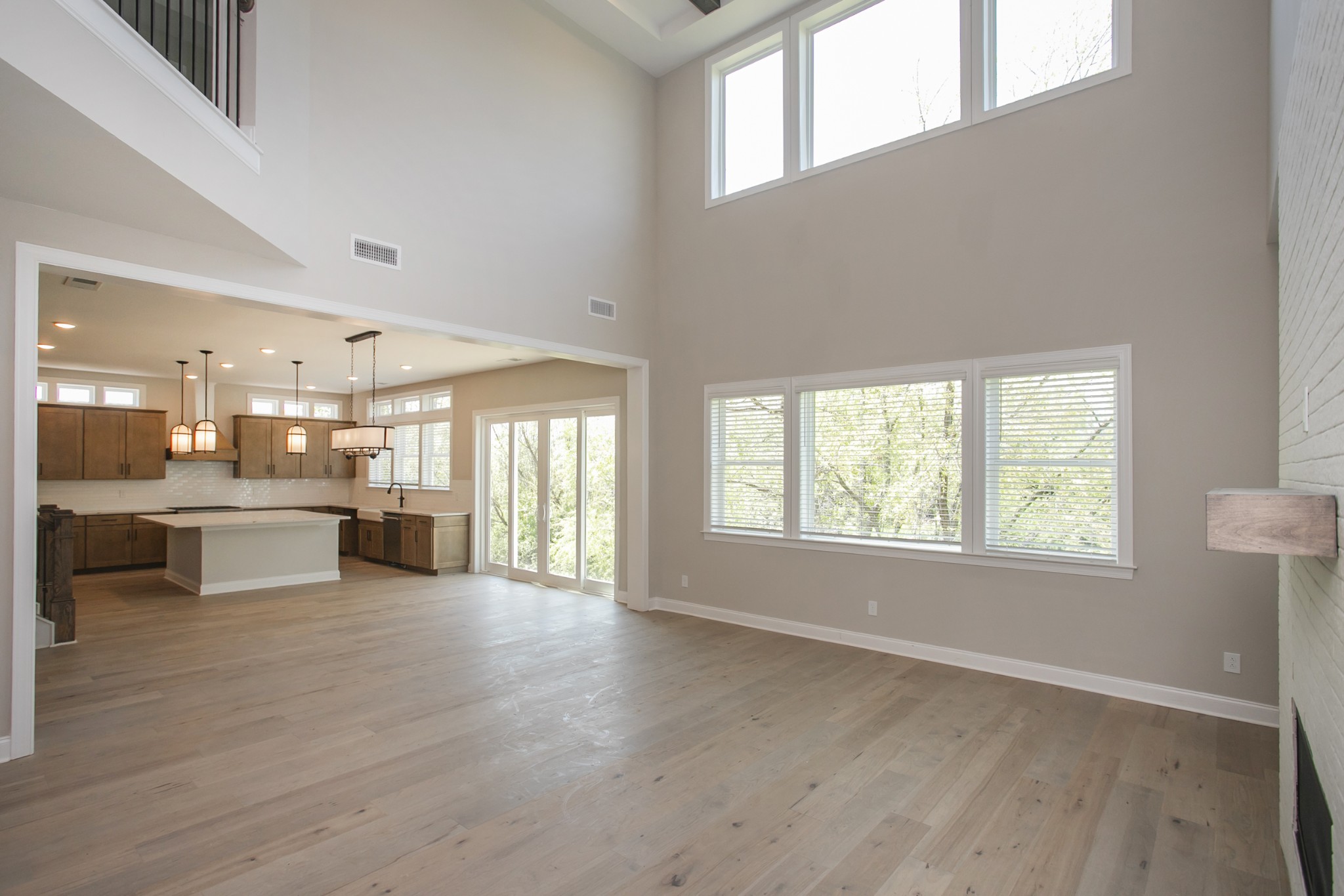 5956 Hunt Vly Drive Spring Hill, TN 37174 - Photo 23 of 53 a view of a kitchen and dining room with wooden floor