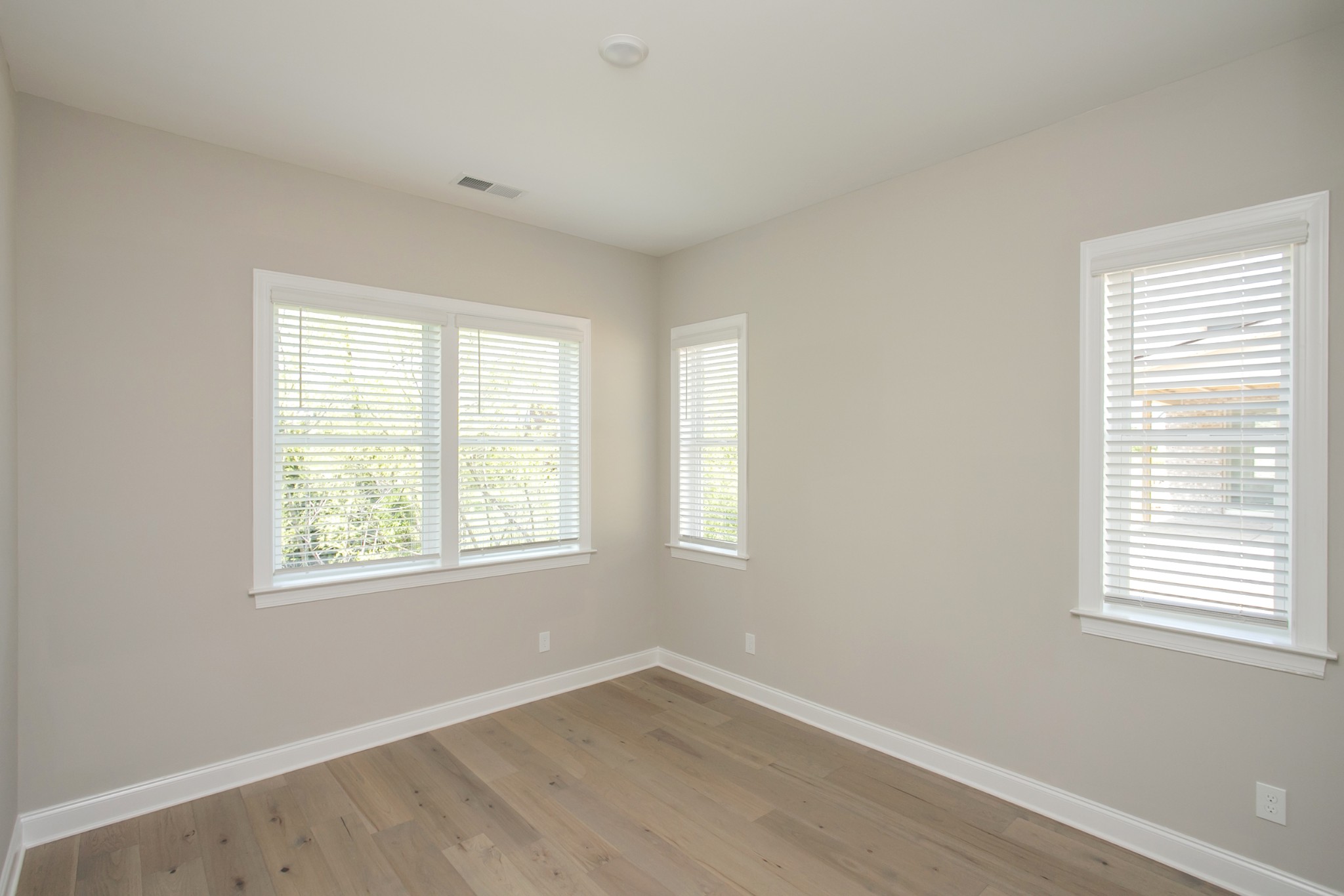 5956 Hunt Vly Drive Spring Hill, TN 37174 - Photo 28 of 53 a view of an empty room with wooden floor and a window