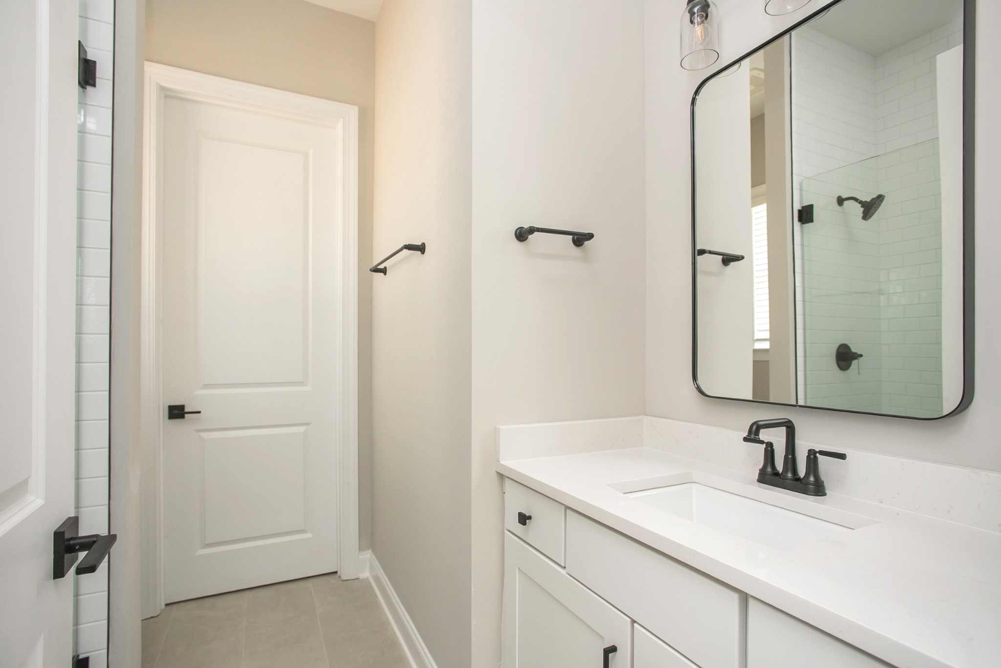 5956 Hunt Vly Drive Spring Hill, TN 37174 - Photo 29 of 53 a bathroom with a granite countertop sink a mirror and shower