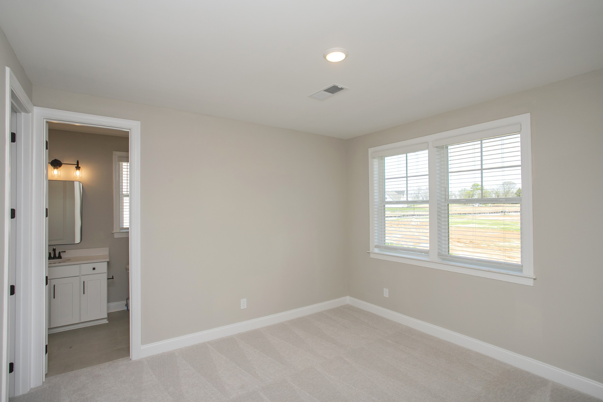 5956 Hunt Vly Drive Spring Hill, TN 37174 - Photo 42 of 53 an empty room with windows and a bathroom