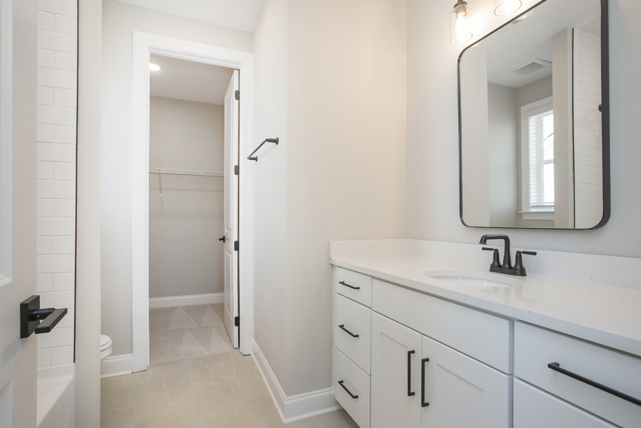 5956 Hunt Vly Drive Spring Hill, TN 37174 - Photo 50 of 53 a bathroom with a sink and a mirror
