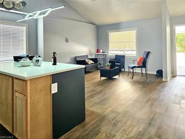 a view of a kitchen counter space and living room