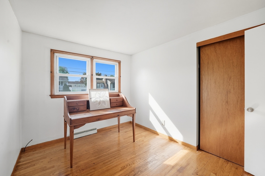 54 Dayton Street Chicopee, MA 01013 - Photo 19 of 25 a living room with furniture and a wooden floor