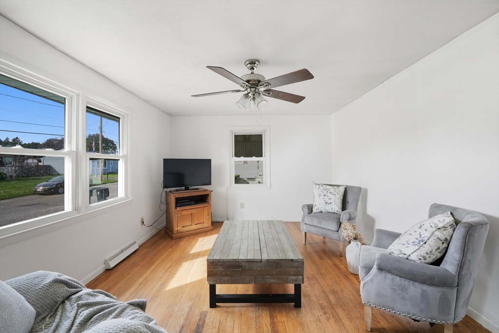 54 Dayton Street Chicopee, MA 01013 - Photo 5 of 25 a living room with furniture and a flat screen tv