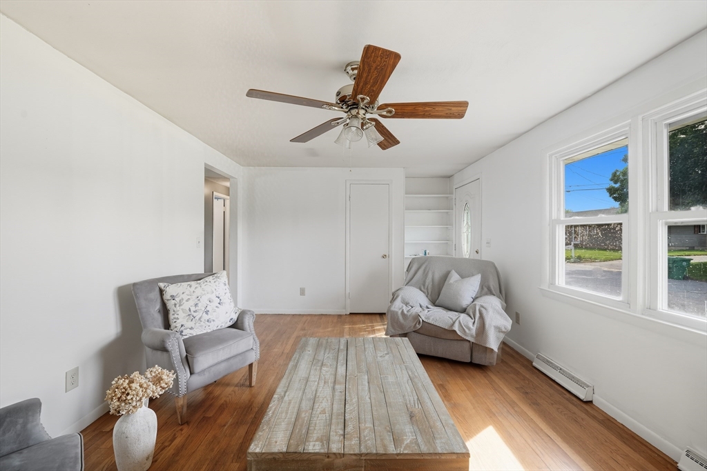 54 Dayton Street Chicopee, MA 01013 - Photo 7 of 25 a living room with furniture and a chandelier