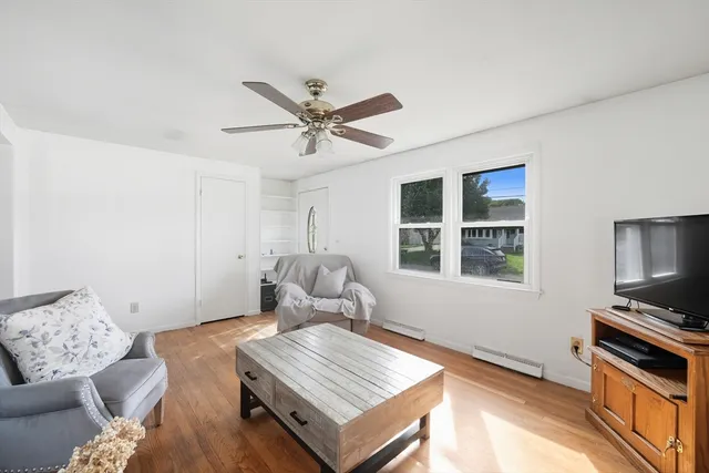 a living room with furniture and a window