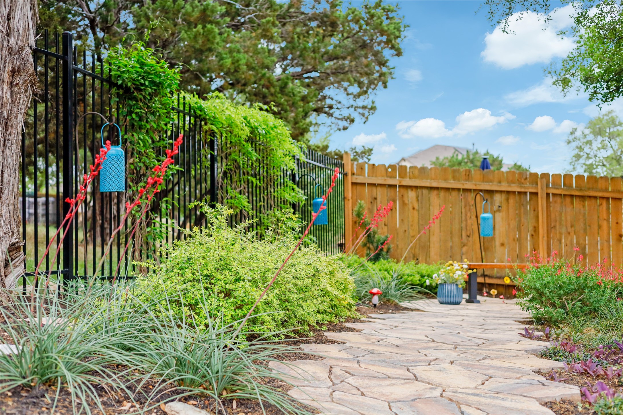 7425 Pace Ravine Drive Lago Vista, TX 78645 - Photo 2 of 40 Back yard is beautifully landscaped and backs to a greenbelt for lots of privacy.