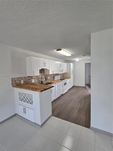 a view of hallway with washer and dryer