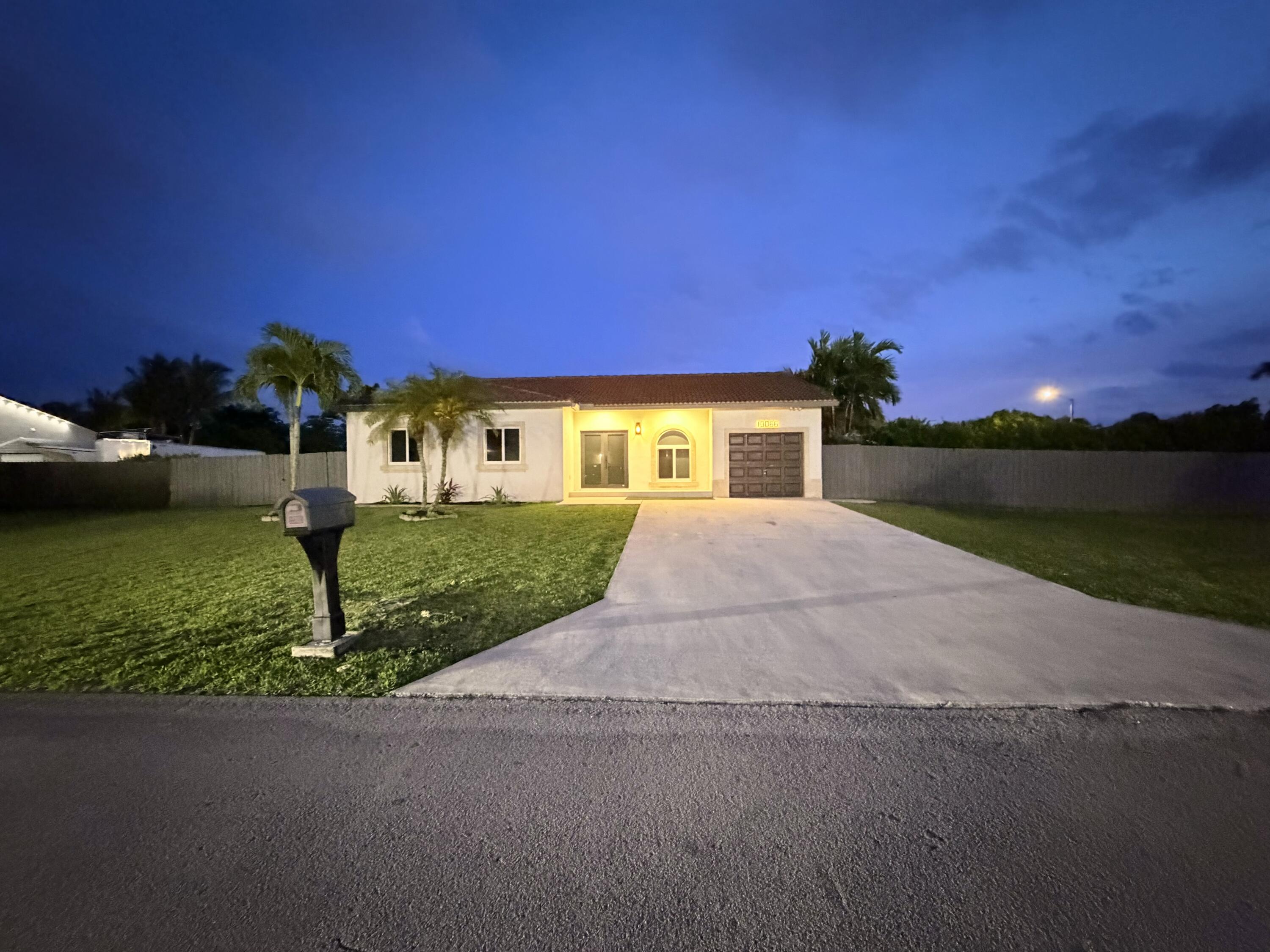 13066 Southwest 218th Terrace Miami, FL 33170 - Photo 5 of 27 outside night 3