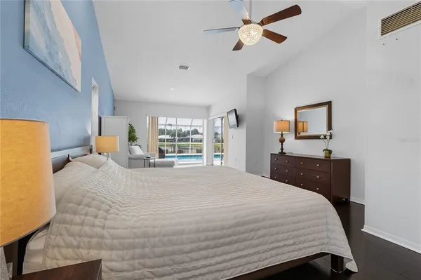 a bedroom with bed couch and window