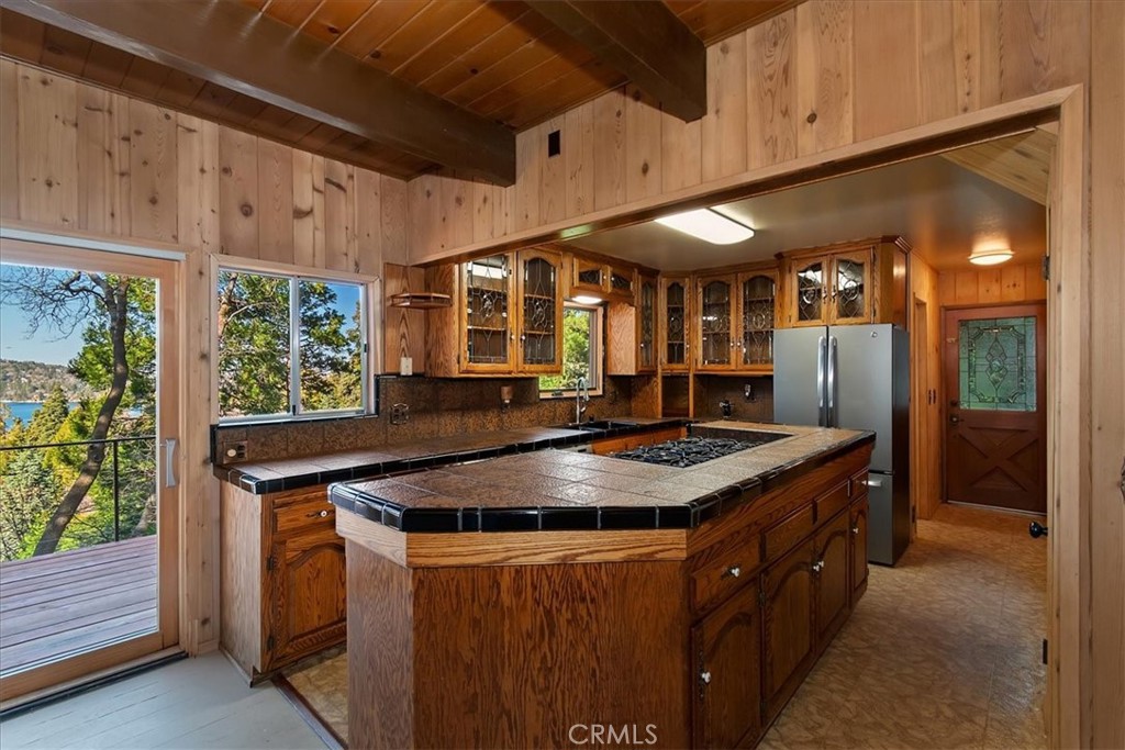 495 Kuffel Canyon Road Lake Arrowhead, CA 92352 - Photo 22 of 64 a kitchen with stainless steel appliances granite countertop a sink a stove and a refrigerator
