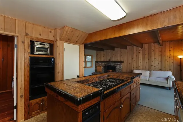 an aerial view of a house with swimming pool and mountain view