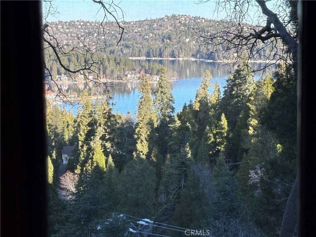 495 Kuffel Canyon Road Lake Arrowhead, CA 92352 - Photo 38 of 64 a water view of water with a building in the background