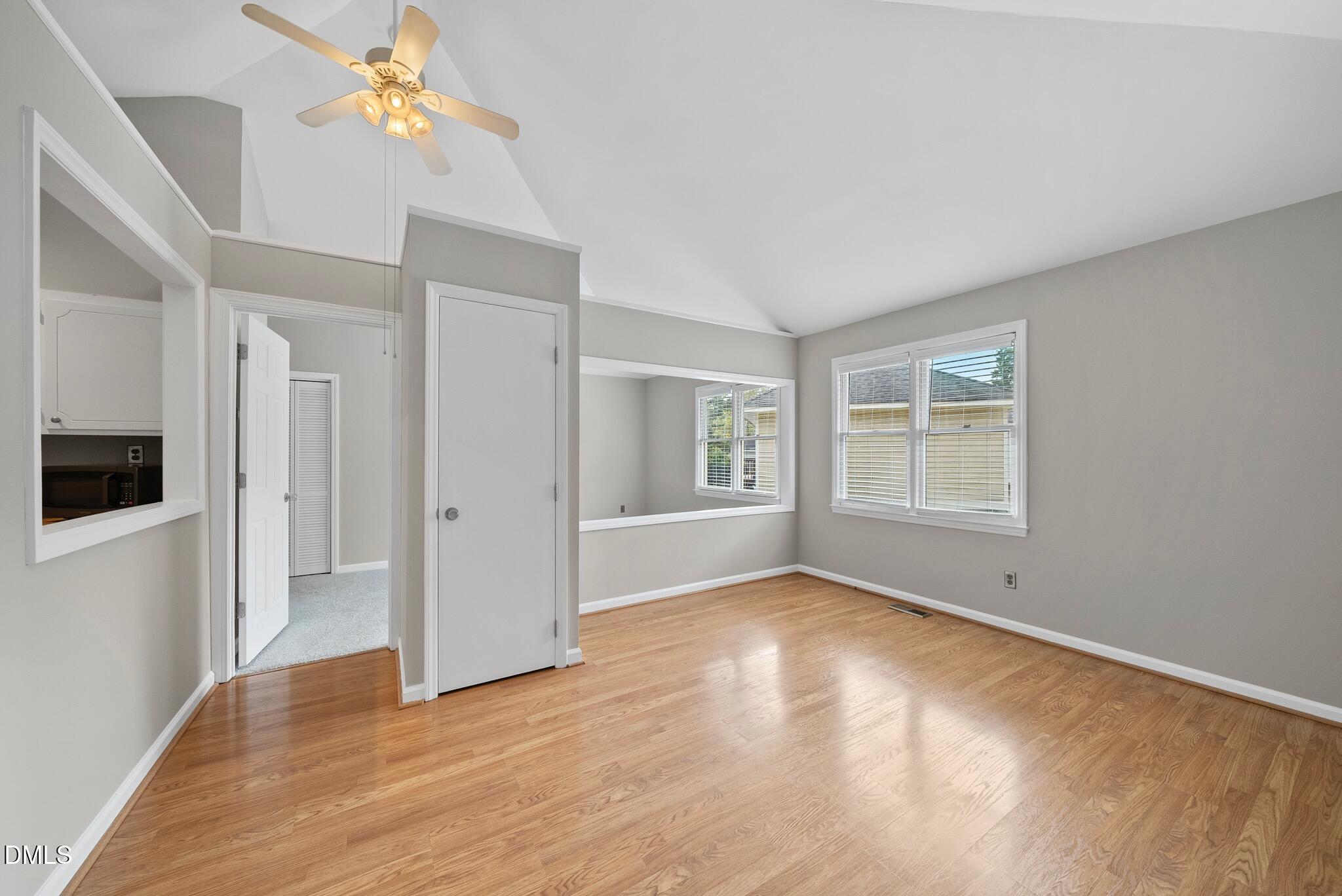 3634 Mill Run Raleigh, NC 27612 - Photo 4 of 18 a view of empty room with wooden floor and fan