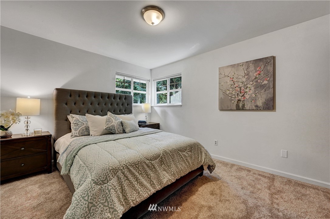 35328 Southeast David Powell Road Fall City, WA 98024 - Photo 22 of 37 a bedroom with a bed and a night stand