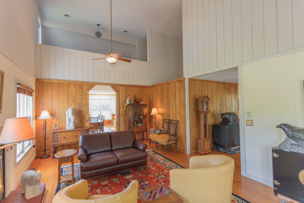 1236 Dutch Hollow Road Raphine, VA 24472 - Photo 19 of 45 a living room with furniture a lamp and a large window