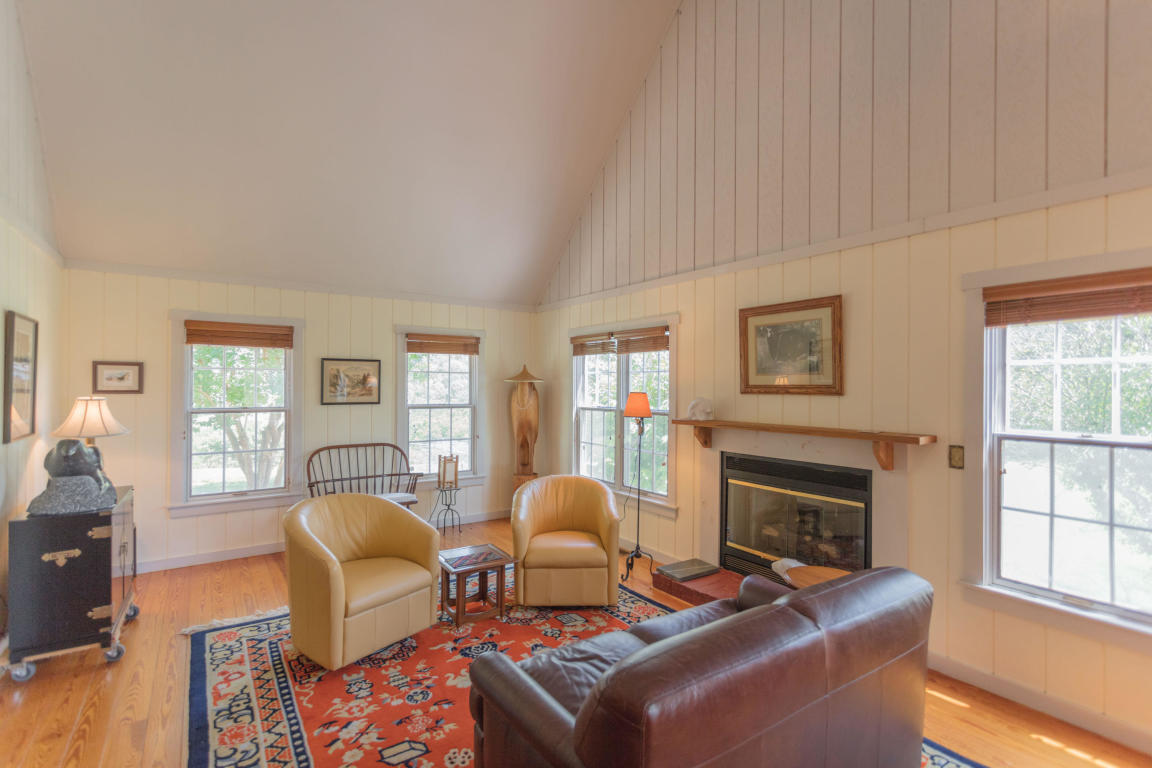 1236 Dutch Hollow Road Raphine, VA 24472 - Photo 20 of 45 a living room with furniture a fireplace and a window