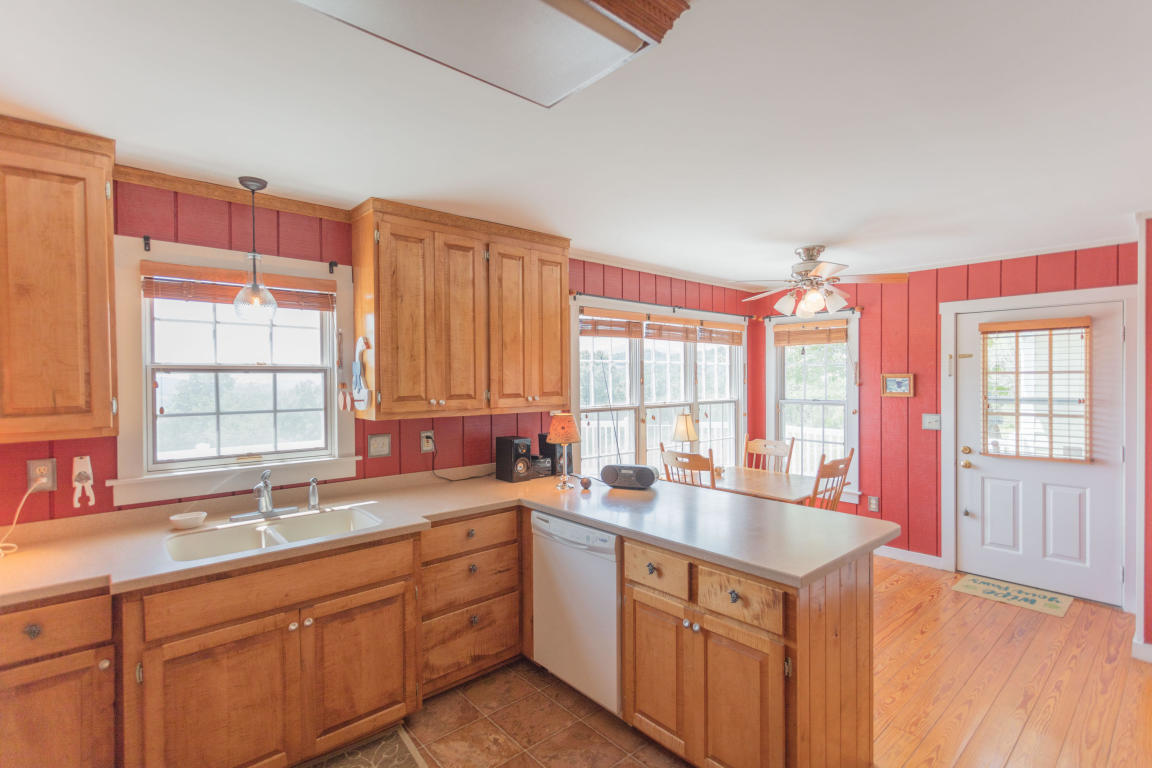 1236 Dutch Hollow Road Raphine, VA 24472 - Photo 21 of 45 a kitchen with a sink stove and cabinets