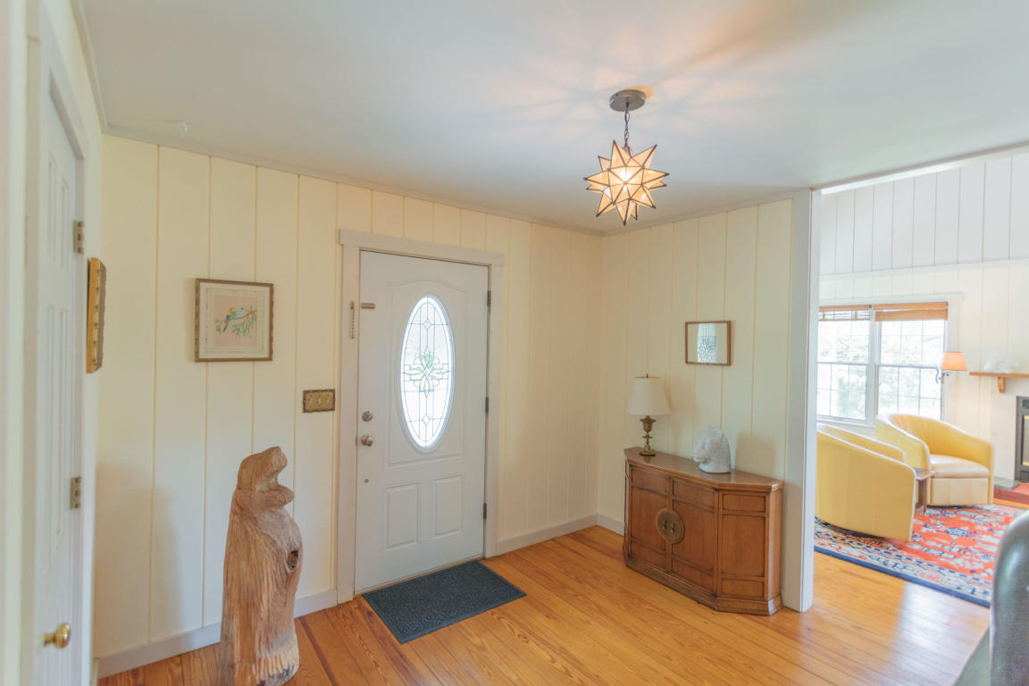1236 Dutch Hollow Road Raphine, VA 24472 - Photo 31 of 45 a living room with furniture and a chandelier