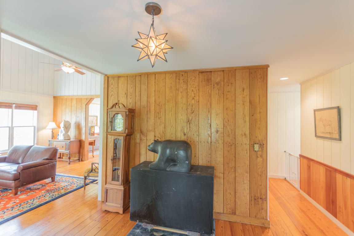 1236 Dutch Hollow Road Raphine, VA 24472 - Photo 32 of 45 a living room with furniture and a chandelier