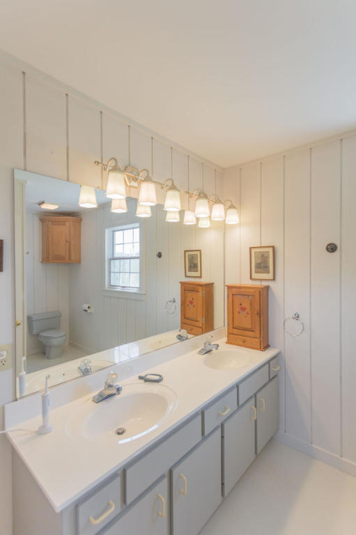 1236 Dutch Hollow Road Raphine, VA 24472 - Photo 36 of 45 a bathroom with double vanity and a mirror