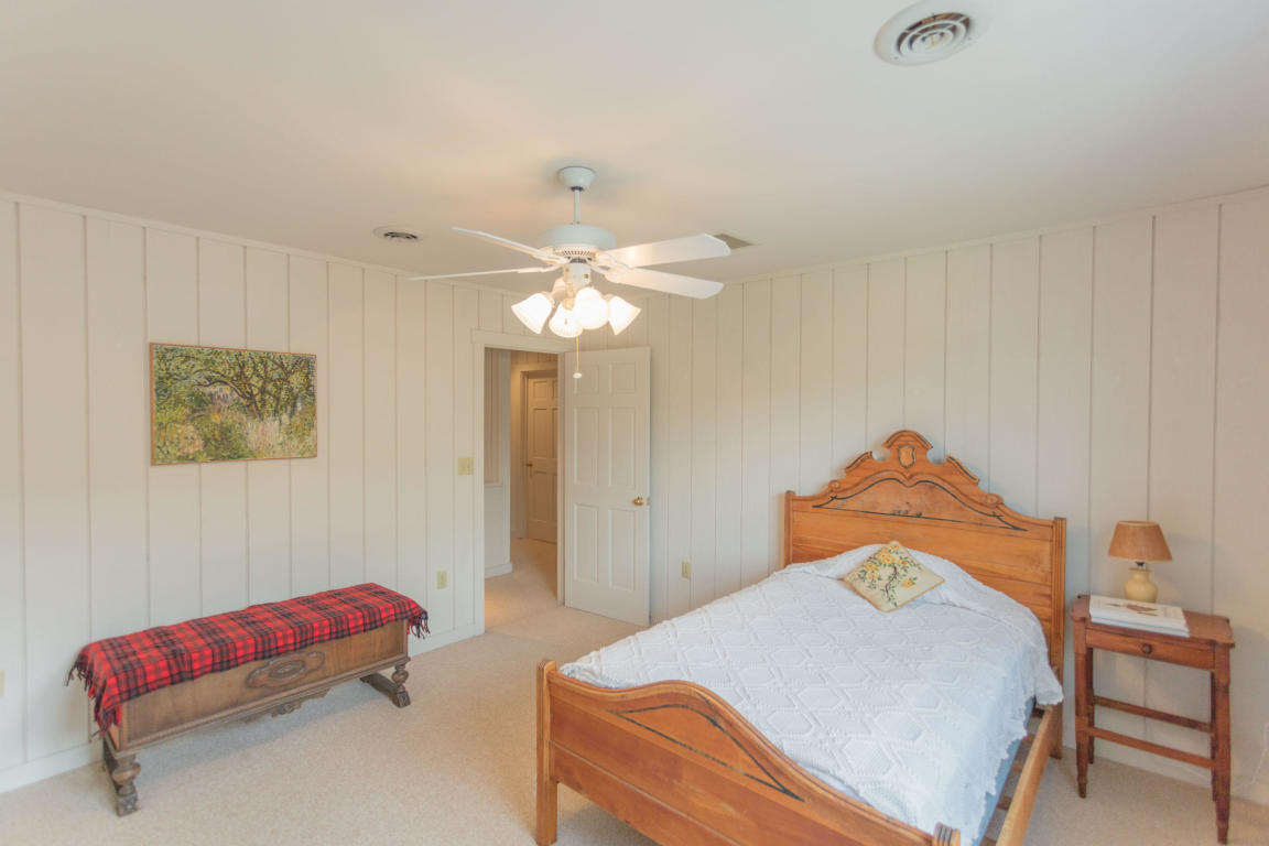1236 Dutch Hollow Road Raphine, VA 24472 - Photo 40 of 45 a bedroom with a bed and a chandelier