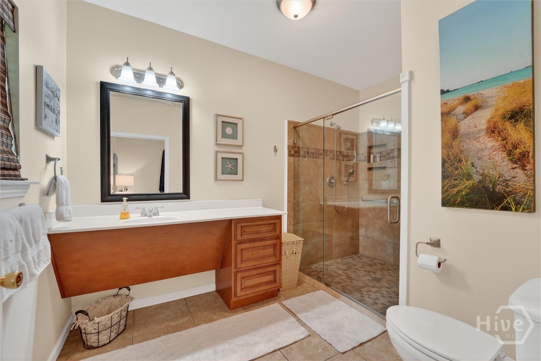 725 Youman's Road Midway, GA 31320 - Photo 23 of 71 Guest en-suite bath #1. Wheelchair accessible, with walk-in shower