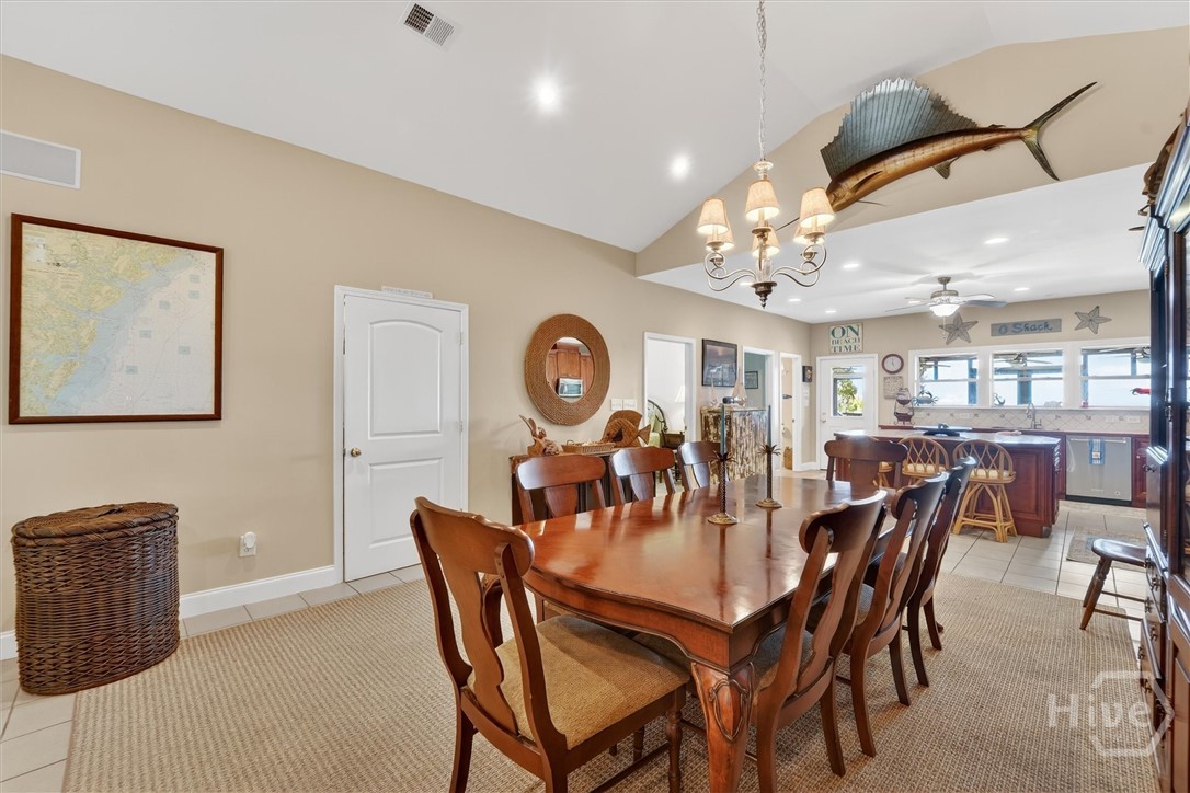 725 Youman's Road Midway, GA 31320 - Photo 7 of 71 Dining area. Door to the left is a hidden bar