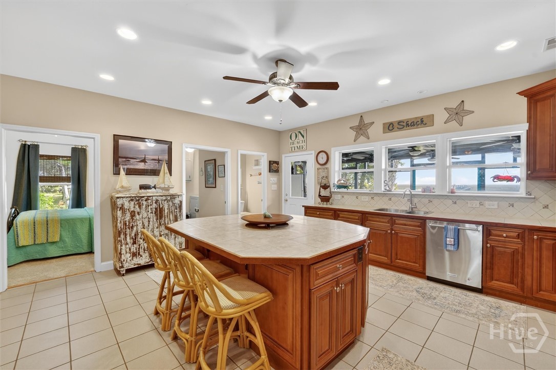 725 Youman's Road Midway, GA 31320 - Photo 10 of 71 Kitchen looking out to the water. Also visible: Guest Suite #3