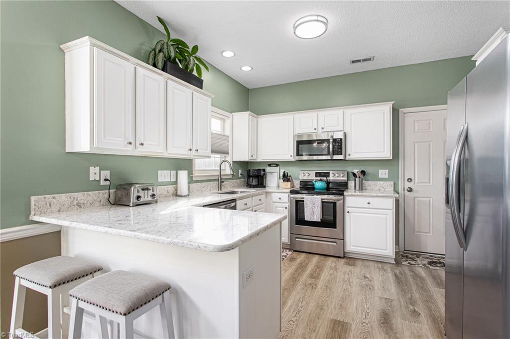 1317 Salem Crossing Road Kernersville, NC 27284 - Photo 11 of 34 Tastefully updated kitchen with quartz countertops