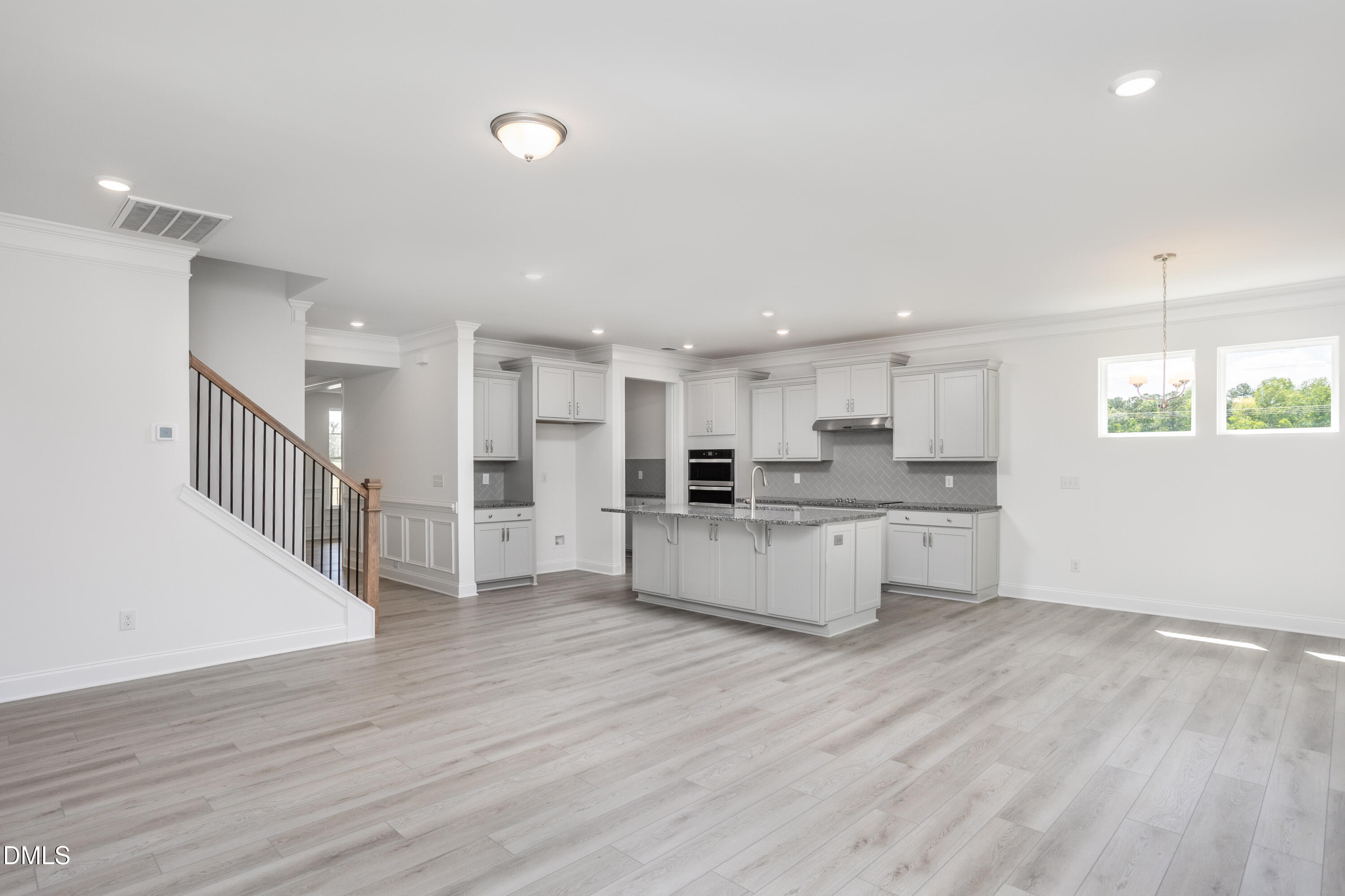 216 Cedar Rdg Trail Angier, NC 27501 - Photo 17 of 33 a large white kitchen with lots of counter space wooden floor and appliances