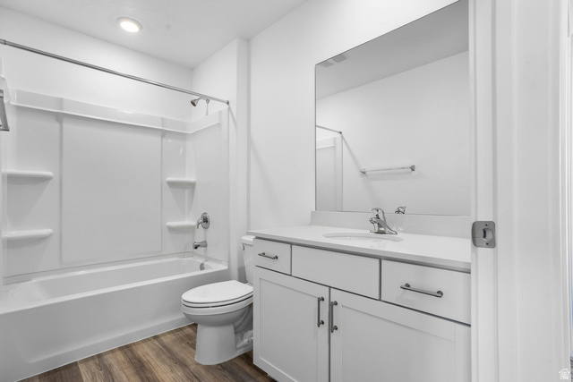 2194 Wolverine Way, Unit 2531 Washington, UT 84780 - Photo 33 of 52 Modern bathroom featuring a white vanity with a light-toned countertop, an undermount sink, and a large frameless mirror