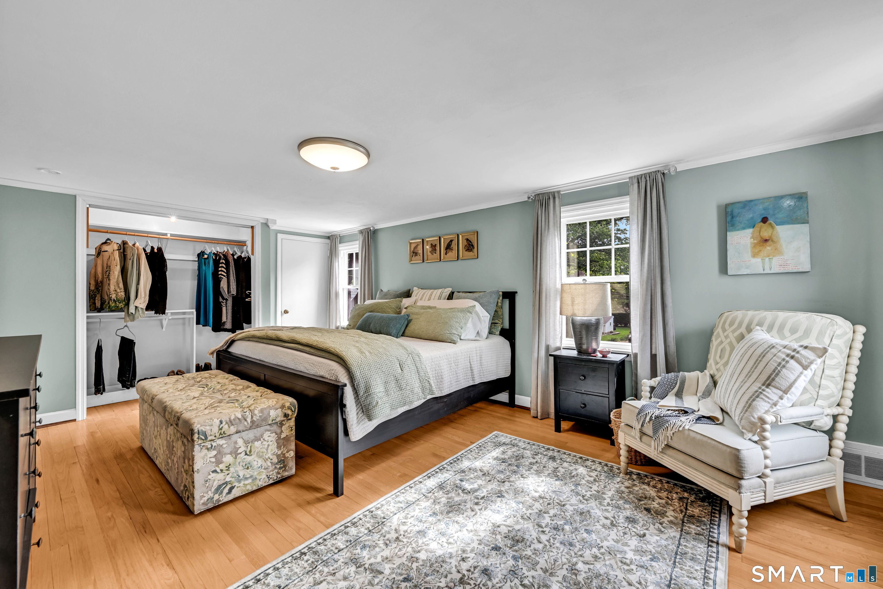 47 Spring Lane West Hartford, CT 06107 - Photo 30 of 38 a spacious bedroom with a bed and wooden floor